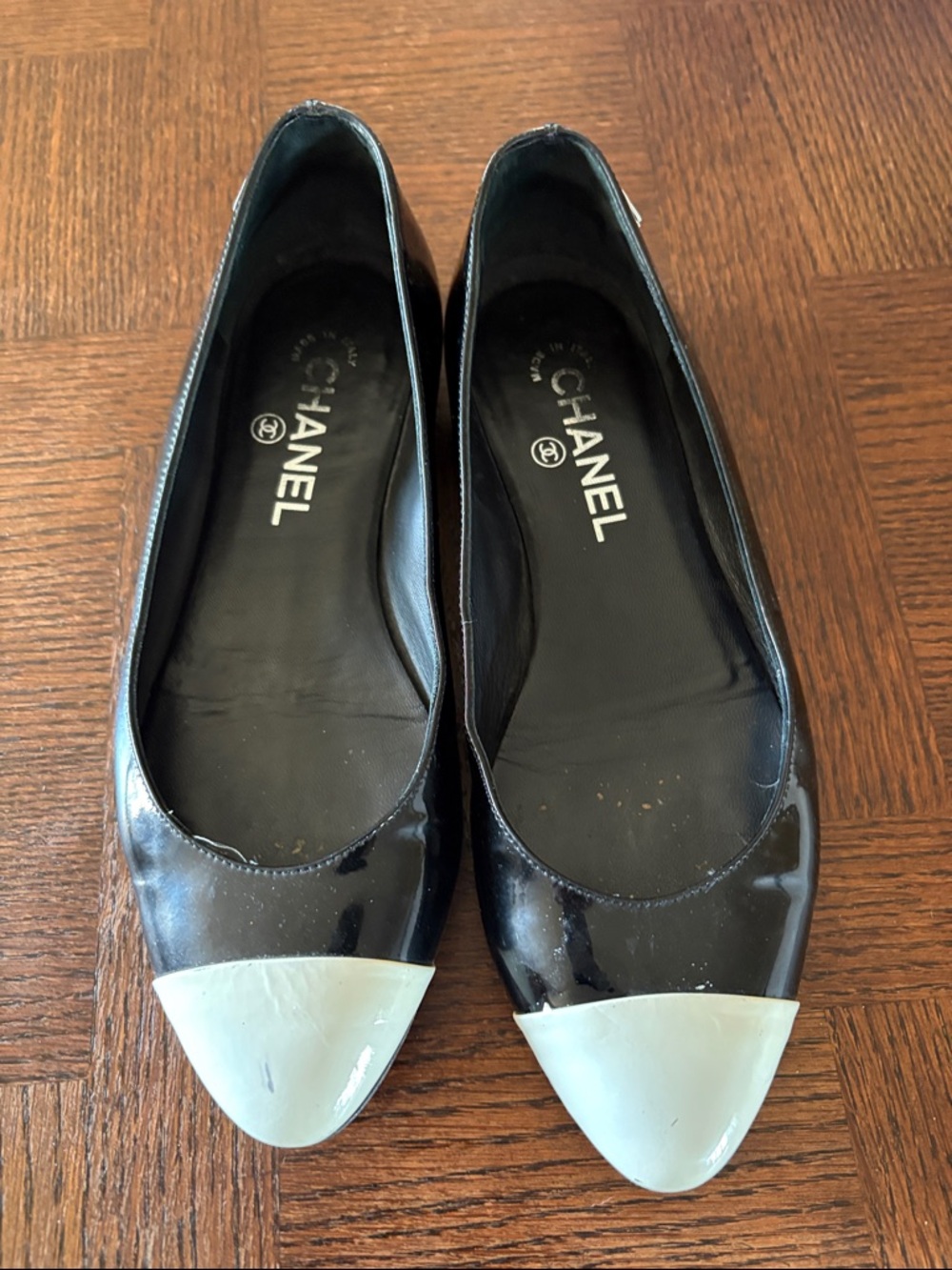 CHANEL Black Patent Leather Ballet Flats with Cream Cap Toe